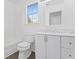 All-white bathroom with modern vanity and fixtures at 5728 Rock Shoals Way, Atlanta, GA 30349