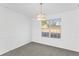 Bright bedroom with a window and modern lighting fixture at 5728 Rock Shoals Way, Atlanta, GA 30349