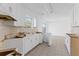 Incomplete kitchen area with white cabinets, tile floors, and abundant natural light at 5728 Rock Shoals Way, Atlanta, GA 30349