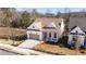 Aerial view of a charming craftsman style home with a tan roof at 210 Idylwilde Way, Canton, GA 30115