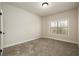 Well-lit bedroom with neutral wall colors and carpet flooring at 210 Idylwilde Way, Canton, GA 30115