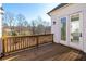Private deck with wood railings offering a wooded view at 210 Idylwilde Way, Canton, GA 30115