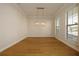 Dining room features hardwood floors and a chandelier at 210 Idylwilde Way, Canton, GA 30115