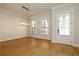 Bright dining room with hardwood floors and chandelier at 210 Idylwilde Way, Canton, GA 30115