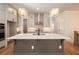 Modern kitchen with large island and stainless steel appliances at 210 Idylwilde Way, Canton, GA 30115