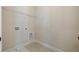 Laundry room with built-in shelving and utility access at 210 Idylwilde Way, Canton, GA 30115