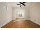 Spacious living room with hardwood floors and large windows at 210 Idylwilde Way, Canton, GA 30115