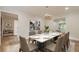 Elegant dining room with a large table and modern light fixture at 2911 Bentwood Dr, Marietta, GA 30062