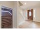 Elegant entryway with wood floors, wine cellar, and staircase at 2911 Bentwood Dr, Marietta, GA 30062