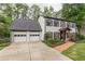 Two-story house with white siding, black shutters, and two-car garage at 2911 Bentwood Dr, Marietta, GA 30062