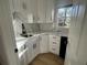 Modern white kitchen with quartz countertops and corner sink at 2911 Bentwood Dr, Marietta, GA 30062