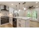 Modern kitchen with white cabinets, quartz countertops, and stainless steel appliances at 2911 Bentwood Dr, Marietta, GA 30062