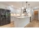 Modern kitchen with white cabinets, quartz countertops, and stainless steel appliances at 2911 Bentwood Dr, Marietta, GA 30062