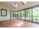 Screened porch overlooking backyard and water feature; terracotta tile floor at 2911 Bentwood Dr, Marietta, GA 30062