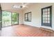 Spacious screened porch with terracotta tile floor and access to backyard at 2911 Bentwood Dr, Marietta, GA 30062