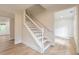 Elegant staircase with white railings leading to the upper level of the home at 2911 Bentwood Dr, Marietta, GA 30062