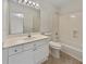 Bright bathroom features vanity, a tub-shower combo, white fixtures and cabinets, and a large mirror at 3714 Thunder Ne Way, Marietta, GA 30066