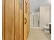 Modern bathroom with a sauna, tiled floors, walk-in shower, and toilet with white and wood accents at 3714 Thunder Ne Way, Marietta, GA 30066