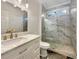 Modern bathroom with marble countertop, glass shower, and elegant gold fixtures at 3714 Thunder Ne Way, Marietta, GA 30066
