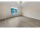 Inviting bedroom with hardwood floors, a large window for natural light, and neutral wall colors at 3714 Thunder Ne Way, Marietta, GA 30066
