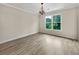 Bright bedroom with wood floors, large window with serene view, and neutral tones at 3714 Thunder Ne Way, Marietta, GA 30066