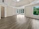 Expansive bedroom features wood floors, tray ceiling, recessed lighting, and many large windows at 3714 Thunder Ne Way, Marietta, GA 30066