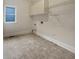 Practical laundry room with storage cabinets and shelving for organization at 3714 Thunder Ne Way, Marietta, GA 30066