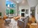 Bright living room featuring hardwood floors, large windows, and a fireplace, perfect for entertaining at 3714 Thunder Ne Way, Marietta, GA 30066