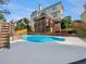 Backyard pool with slide, wooden deck, and a spacious patio for outdoor entertainment at 3714 Thunder Ne Way, Marietta, GA 30066