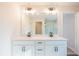 Double vanity bathroom with modern fixtures and a large mirror at 147 Bluffington Way, Marietta, GA 30066