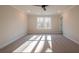 Bright bedroom with carpet flooring and large window at 147 Bluffington Way, Marietta, GA 30066