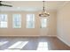 Dining room with hardwood floors, chandelier, and exterior access at 147 Bluffington Way, Marietta, GA 30066