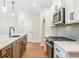 Modern kitchen features stainless steel appliances and shaker cabinets at 147 Bluffington Way, Marietta, GA 30066