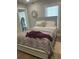 Cozy bedroom with a queen-size bed and neutral decor at 1682 Connally Dr, Atlanta, GA 30344