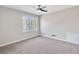 Bright bedroom with carpet flooring and large window at 388 Fieldstone Sw Ct, Lilburn, GA 30047