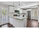 Modern kitchen with white cabinets, stainless steel appliances, and granite countertops at 388 Fieldstone Sw Ct, Lilburn, GA 30047