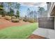 Landscaped backyard with grassy area and privacy fence at 5760 Vista Brook Dr, Suwanee, GA 30024