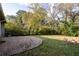 Spacious backyard with brick patio and mature trees at 1863 Derrill Dr, Decatur, GA 30032