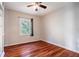 Bright bedroom featuring hardwood floors and built-in shelving at 1863 Derrill Dr, Decatur, GA 30032