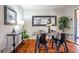 Bright dining room with a rustic wood table and black metal chairs at 1863 Derrill Dr, Decatur, GA 30032