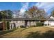 Gray brick ranch house with a well-manicured lawn at 1863 Derrill Dr, Decatur, GA 30032