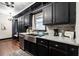 Modern kitchen with stainless steel appliances and dark cabinetry at 1863 Derrill Dr, Decatur, GA 30032