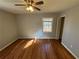 Spacious bedroom with hardwood floors, window, and closet at 2534 Sharpsburg Ct, Decatur, GA 30034