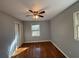 Bright bedroom with hardwood floors and a large window with blinds at 2534 Sharpsburg Ct, Decatur, GA 30034