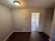 Bright dining area with dark vinyl flooring and access to the backyard at 2534 Sharpsburg Ct, Decatur, GA 30034