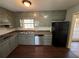 Efficient kitchen featuring ample cabinet space and stainless steel dishwasher at 2534 Sharpsburg Ct, Decatur, GA 30034