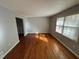 Sunlit living room featuring hardwood floors and large windows at 2534 Sharpsburg Ct, Decatur, GA 30034