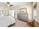 Bedroom with dresser, bench, and access to bathroom at 2865 Lenox Ne Rd # 208, Atlanta, GA 30324
