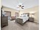 Spacious bedroom with carpeted floor, ceiling fan, and large windows at 2865 Lenox Ne Rd # 208, Atlanta, GA 30324
