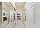Large walk-in closet with mirrored doors and built-in shelving at 2865 Lenox Ne Rd # 208, Atlanta, GA 30324